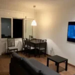 Fully furnished student apartment room in C/ de Muntaner 89 Barcelona with double bed, study desk, wardrobe, and natural light