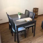 Fully furnished student apartment room in C/ de Muntaner 89 Barcelona with double bed, study desk, wardrobe, and natural light