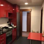 Fully furnished student apartment room in C/ de Muntaner 89 Barcelona with double bed, study desk, wardrobe, and natural light