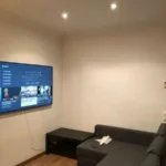 Fully furnished student apartment room in C/ de Muntaner 89 Barcelona with double bed, study desk, wardrobe, and natural light