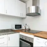 Bright student apartment living room in Carrer de Tordera Barcelona