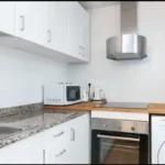 Bright student apartment living room in Carrer de Tordera Barcelona