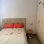 Bright student apartment in La Barceloneta Barcelona with balcony air conditioning and furnished interiors