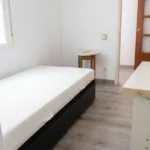 Furnished student room in Eixample Barcelona with private bathroom desk and built-in wardrobe