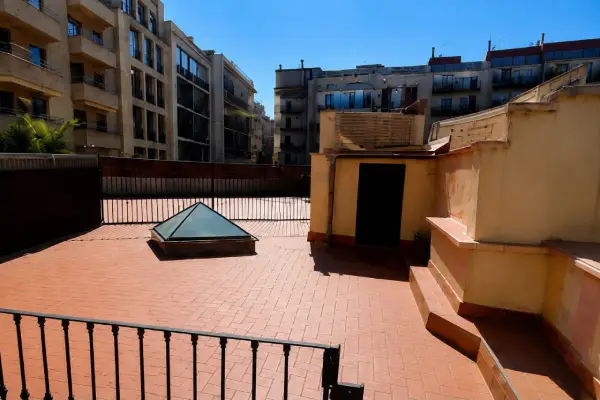 Modern student apartment in Calle d'Aribau Eixample Barcelona with terrace, two bedrooms, and furnished interiors