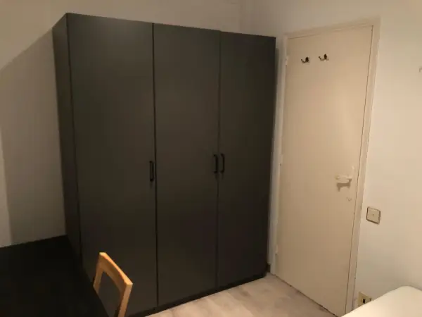 Furnished student room in Eixample Barcelona with private bathroom desk and built-in wardrobe