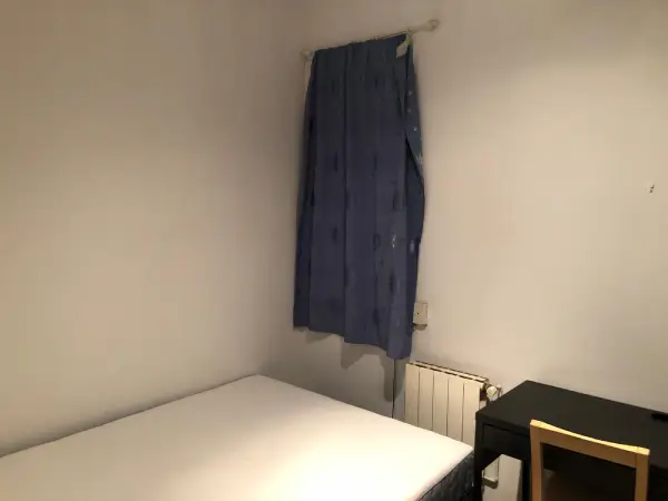 Furnished student room in Eixample Barcelona with private bathroom desk and built-in wardrobe
