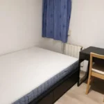 Furnished student room in Eixample Barcelona with private bathroom desk and built-in wardrobe