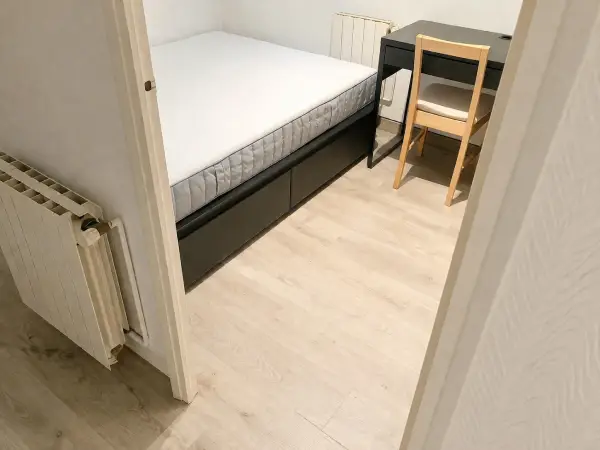 Furnished student room in Eixample Barcelona with private bathroom desk and built-in wardrobe
