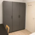 Furnished student room in Eixample Barcelona with private bathroom desk and built-in wardrobe