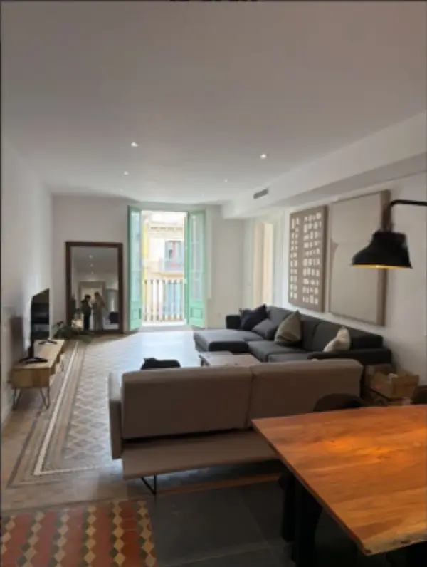 Bright student room in Eixample Barcelona with private bathroom, balcony, and double bed