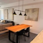 Bright student room in Eixample Barcelona with private bathroom, balcony, and double bed