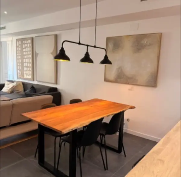 Bright student room in Eixample Barcelona with private bathroom, balcony, and double bed