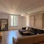 Bright student room in Eixample Barcelona with private bathroom, balcony, and double bed