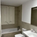 Bright student room in Eixample Barcelona with private bathroom, balcony, and double bed