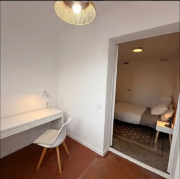 Bright student room in Eixample Barcelona with private bathroom, balcony, and double bed