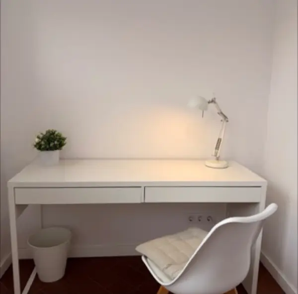 Bright student room in Eixample Barcelona with private bathroom, balcony, and double bed