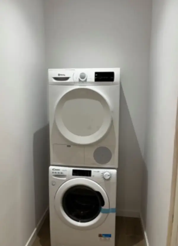 Bright student room in Eixample Barcelona with private bathroom, balcony, and double bed