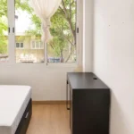 Furnished student room in Eixample Barcelona with private bathroom desk and built-in wardrobe