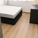 Furnished student room in Eixample Barcelona with private bathroom desk and built-in wardrobe