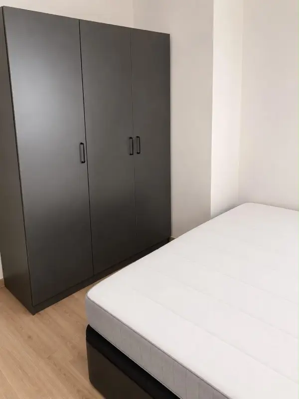 Furnished student room in Eixample Barcelona with private bathroom desk and built-in wardrobe