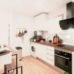 Bright furnished student room in a shared apartment in Barcelona with equipped kitchen