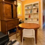 Spacious student room in Plaça Urquinaona Barcelona with double bed, study desk, and shared terrace
