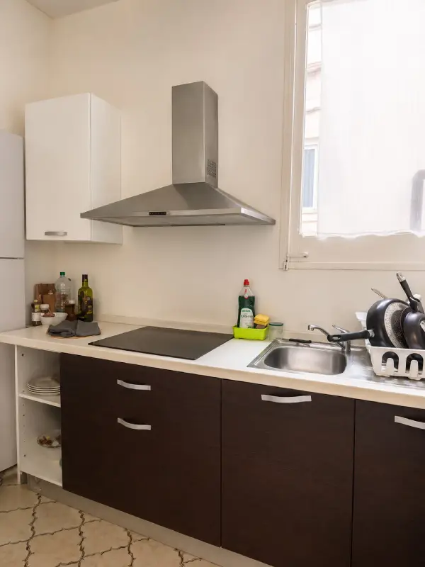 Spacious student room in Plaça Urquinaona Barcelona with double bed, study desk, and shared terrace