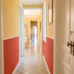 Spacious student room in Plaça Urquinaona Barcelona with double bed, study desk, and shared terrace