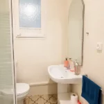 Spacious student room in Plaça Urquinaona Barcelona with double bed, study desk, and shared terrace