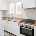 2-bedroom student apartment in Gràcia Barcelona with sunny 12 m² terrace and equipped kitchen